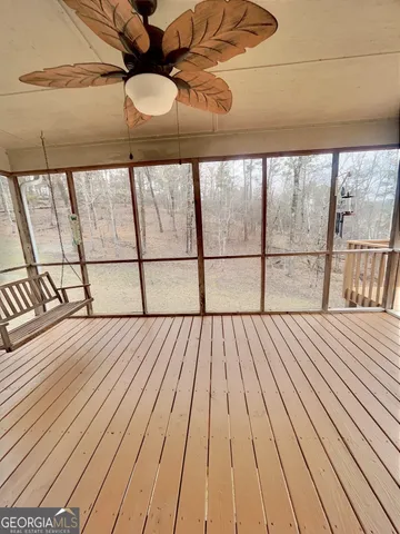 a view of a balcony with wooden floor
