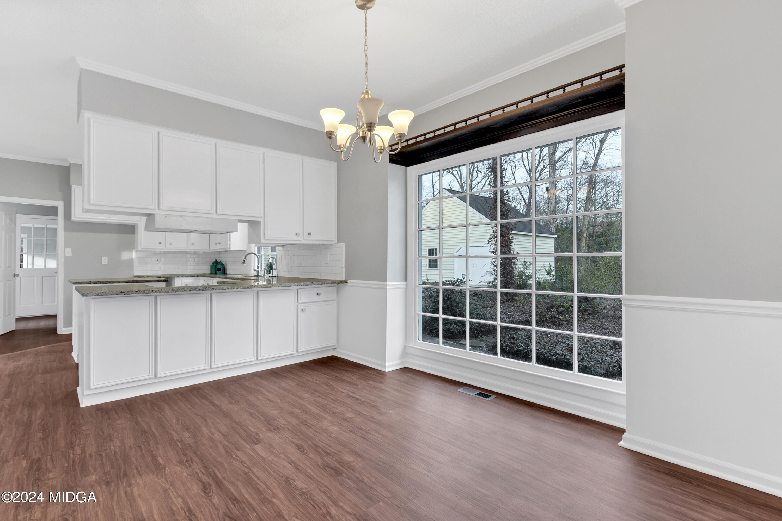 401 Stone Edge Road Macon, GA 31210 - Photo 20 of 69 a view of a kitchen with wooden floor and a large window