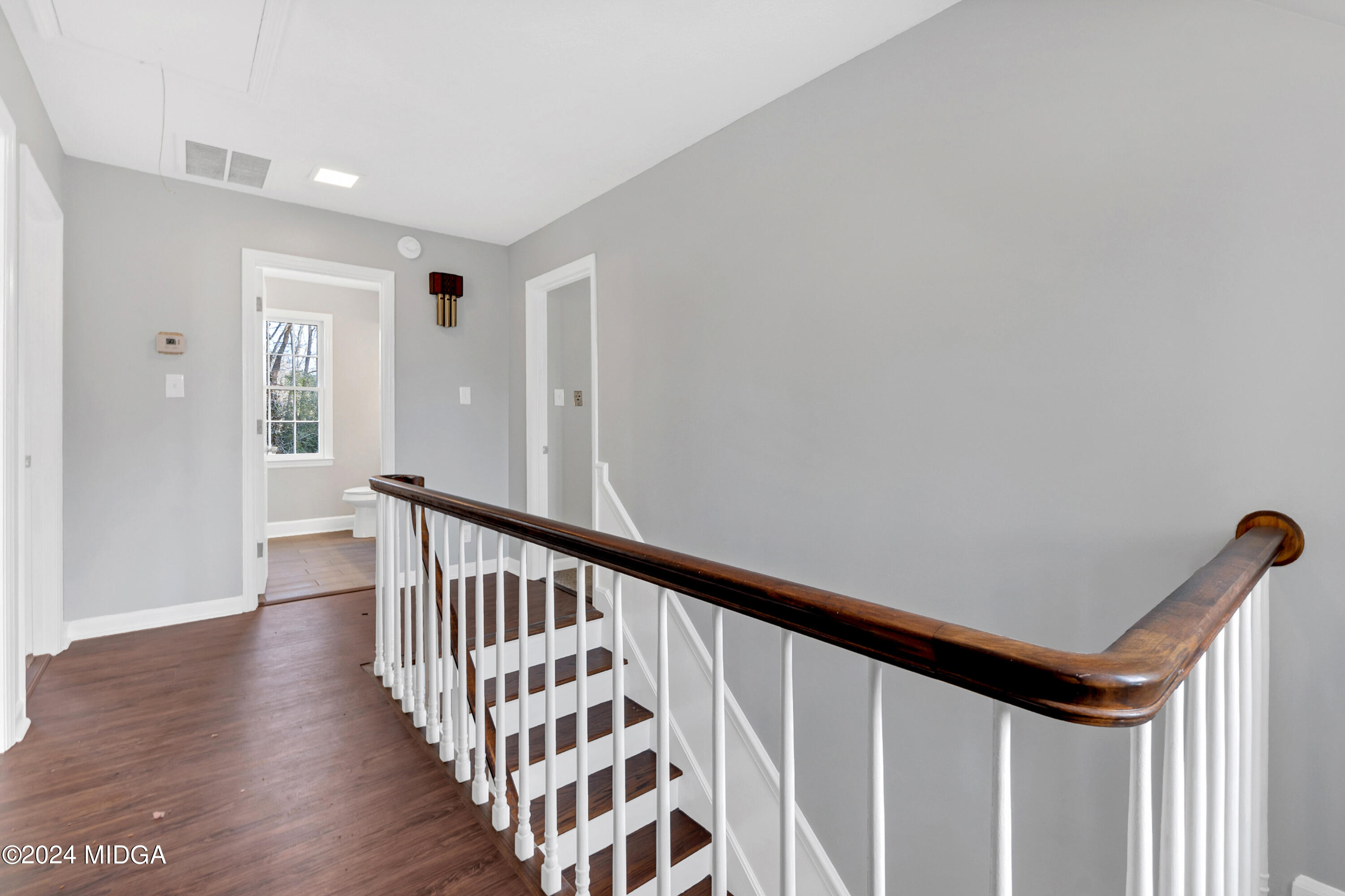 401 Stone Edge Road Macon, GA 31210 - Photo 38 of 69 a view of a hallway with wooden floor and staircase