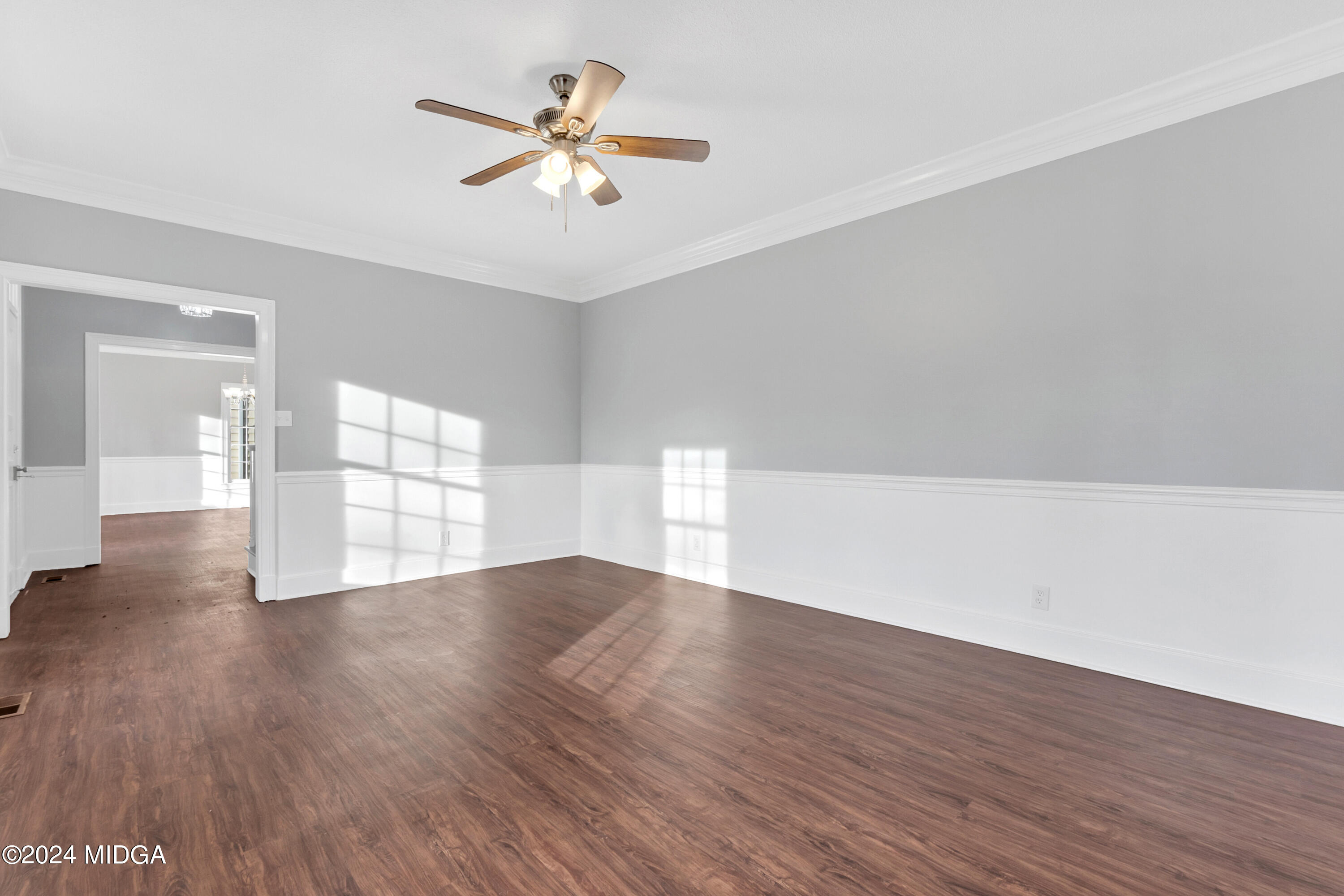 401 Stone Edge Road Macon, GA 31210 - Photo 8 of 69 an empty room with wooden floor and windows