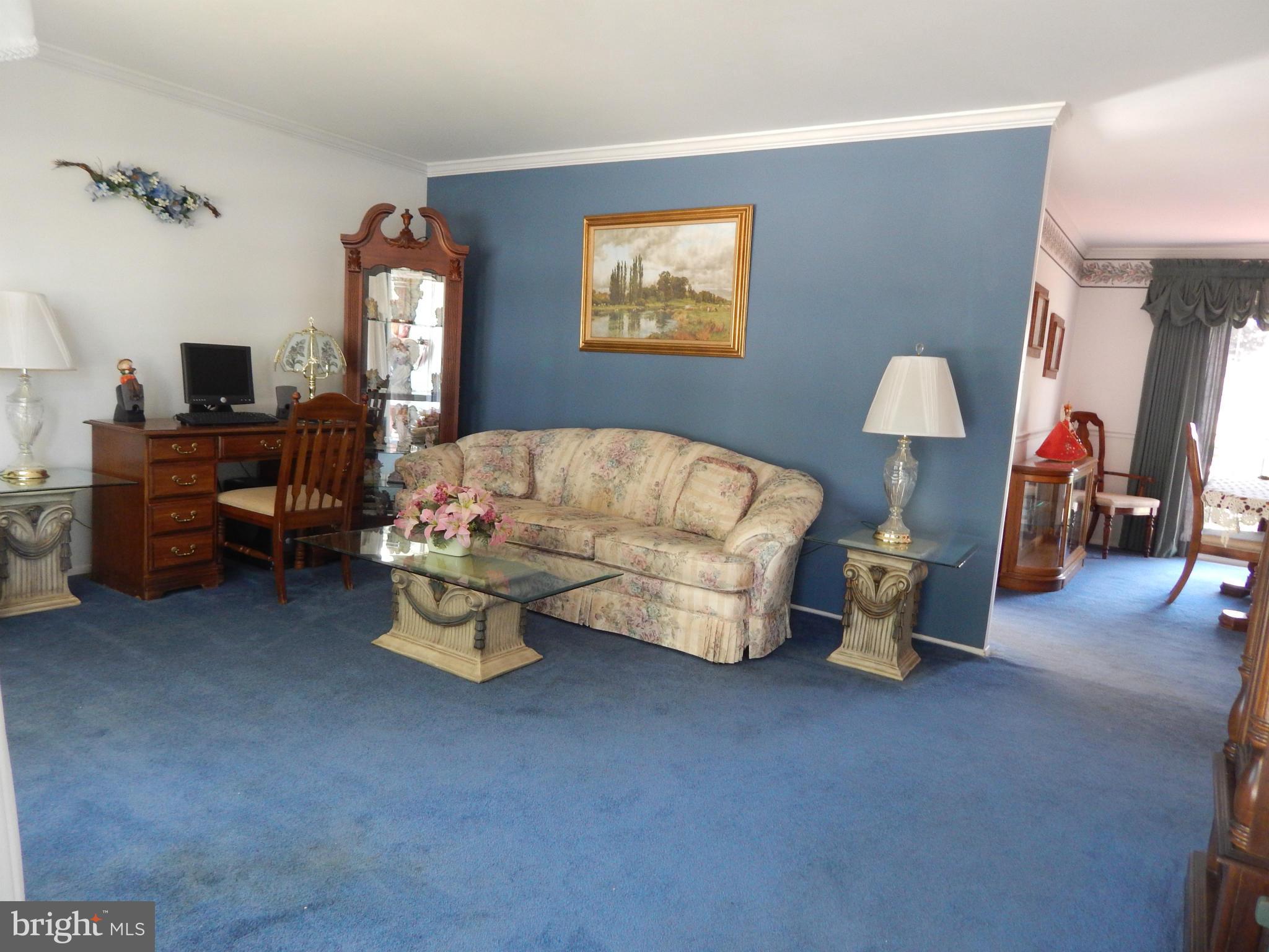 9114 Kilbride Road Baltimore, MD 21236 - Photo 4 of 27 a living room with furniture and a window