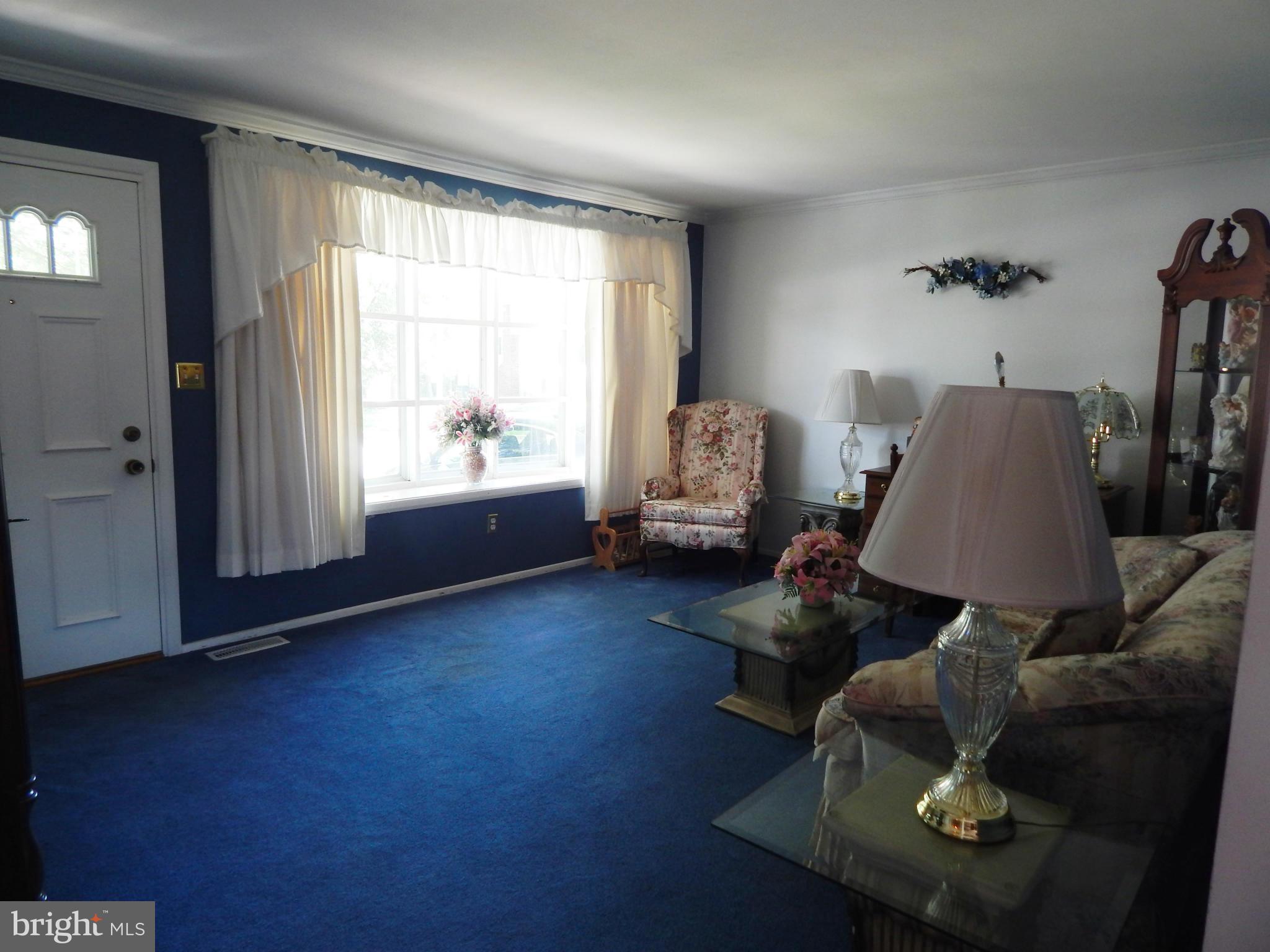 9114 Kilbride Road Baltimore, MD 21236 - Photo 5 of 27 a living room with furniture and a window