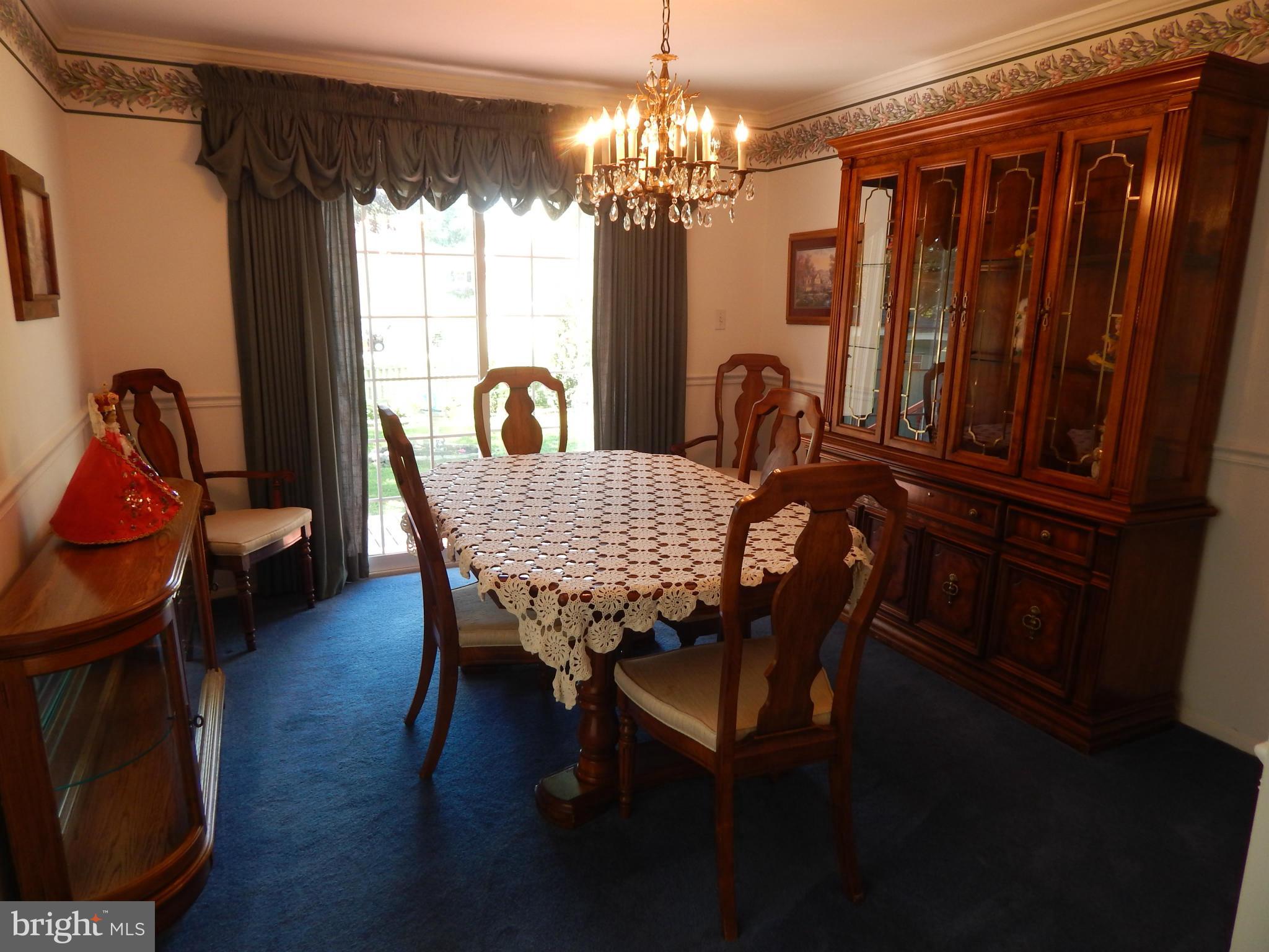9114 Kilbride Road Baltimore, MD 21236 - Photo 7 of 27 a view of a dining room with furniture and window