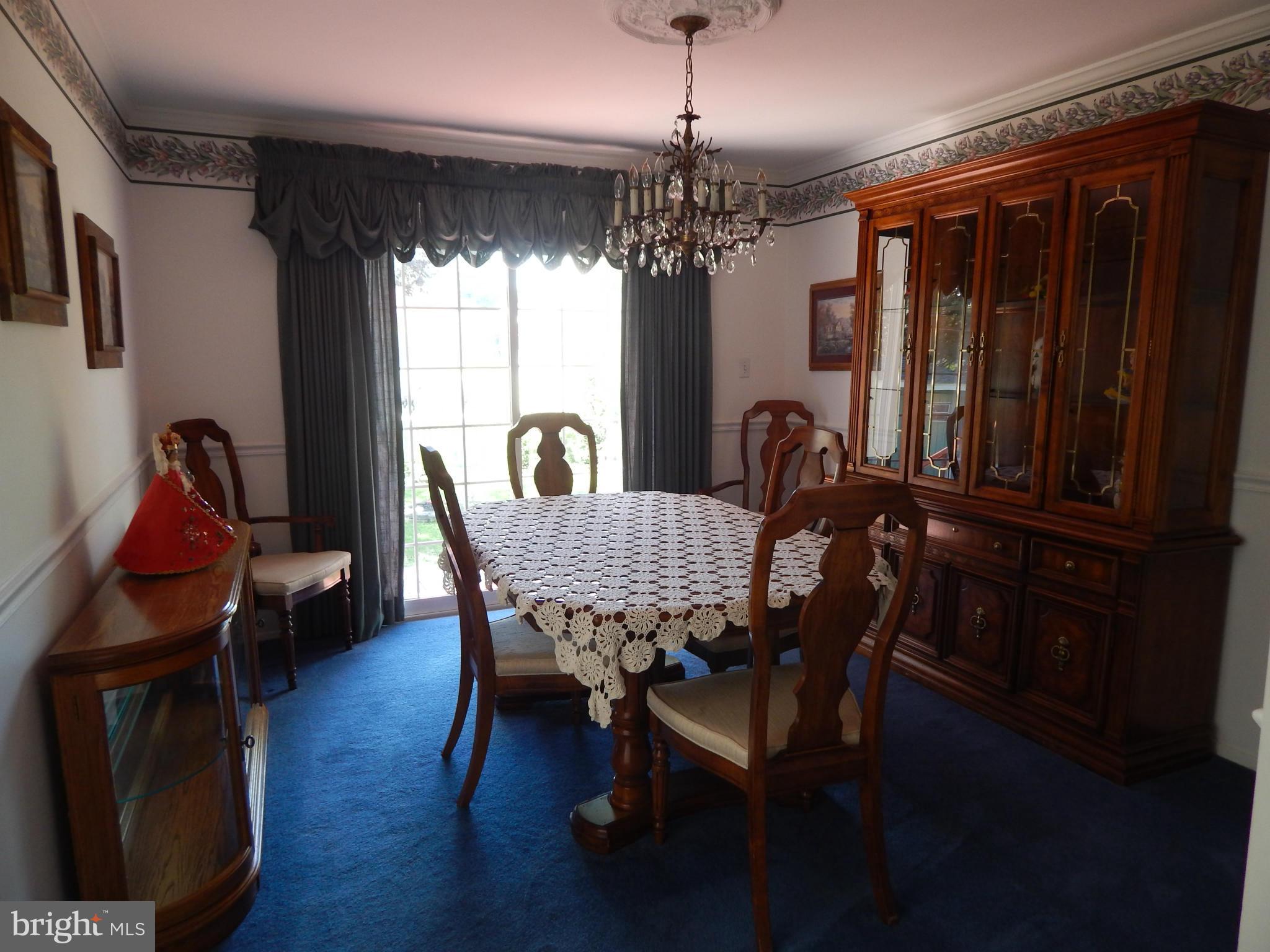 9114 Kilbride Road Baltimore, MD 21236 - Photo 8 of 27 a view of a dining room with furniture window and wooden floor