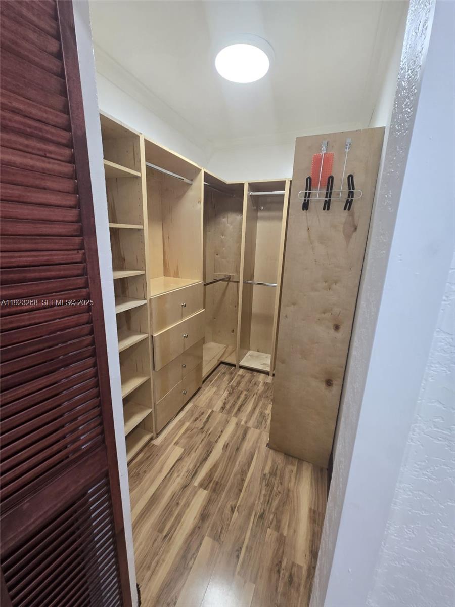 5790 West 12th Lane, Unit 1 Hialeah, FL 33012 - Photo 4 of 6 a view of walk in closet