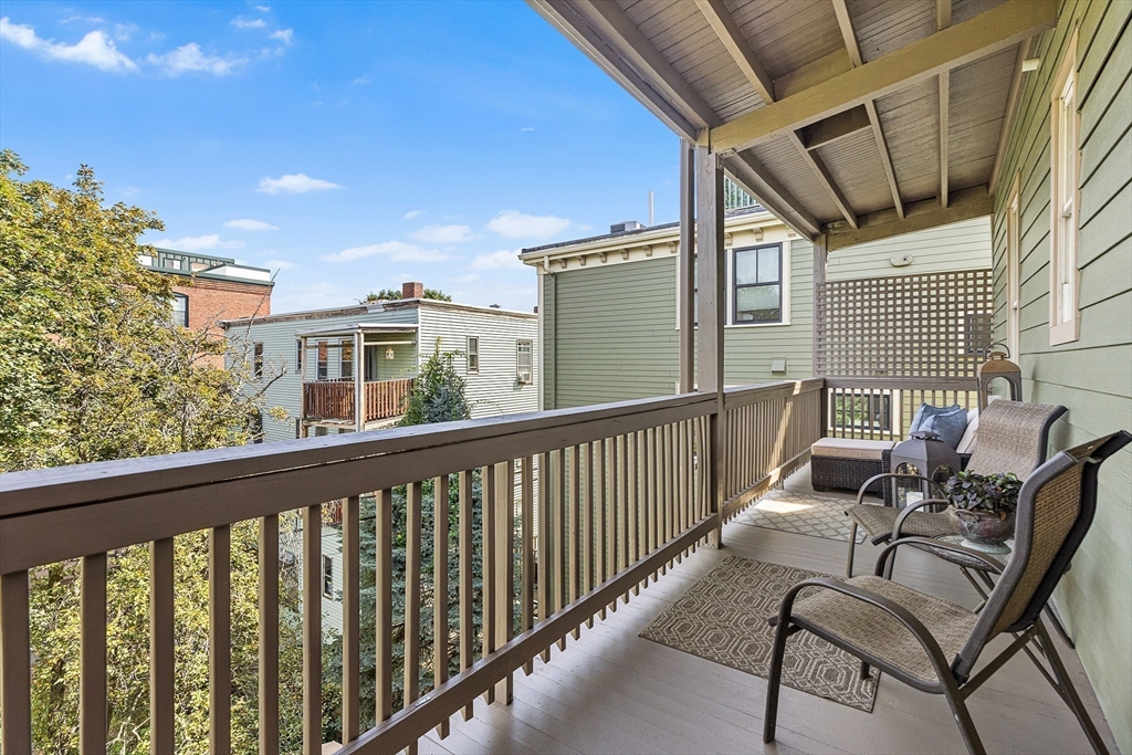 8 Spring Garden Street, Unit 3 Boston, MA 02125 - Photo 26 of 37 a view of a balcony with chairs
