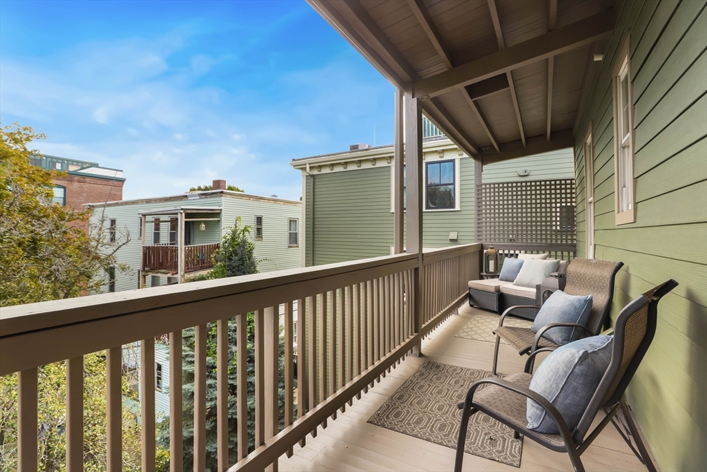 8 Spring Garden Street, Unit 3 Boston, MA 02125 - Photo 27 of 37 a view of a balcony with furniture