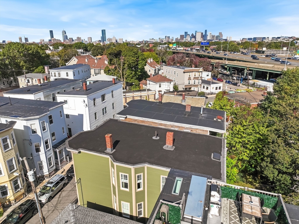 8 Spring Garden Street, Unit 3 Boston, MA 02125 - Photo 28 of 37 a view of a city with tall buildings