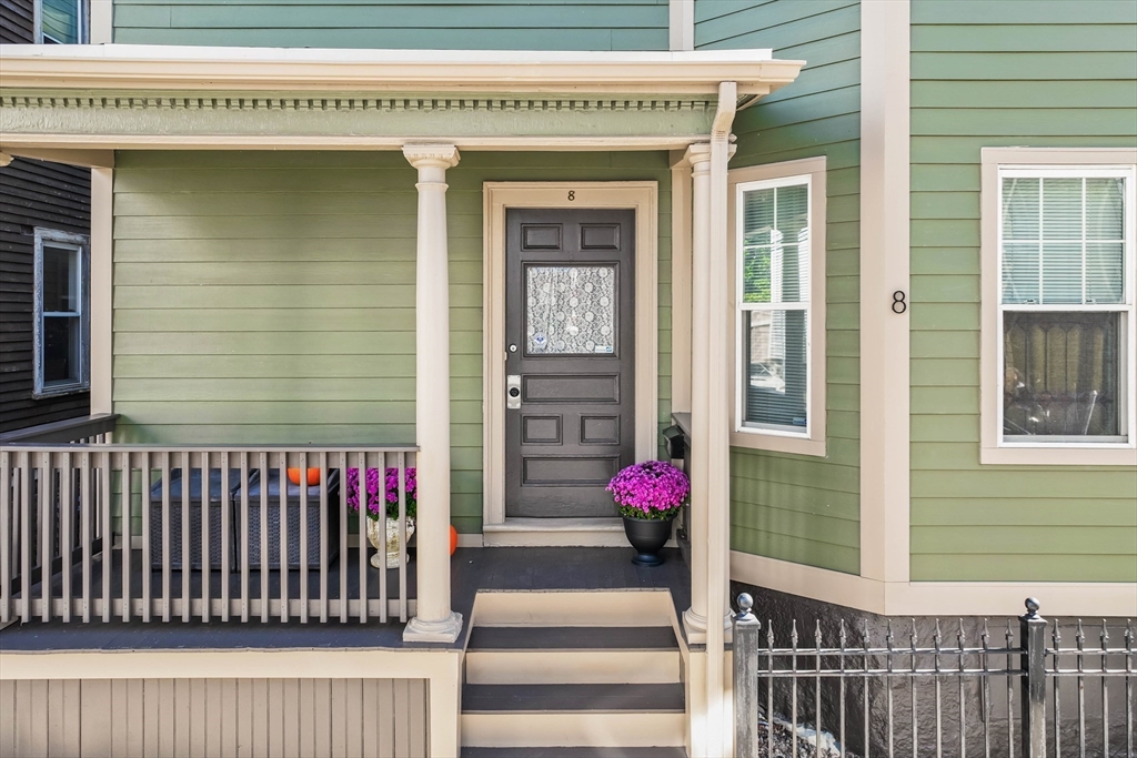 8 Spring Garden Street, Unit 3 Boston, MA 02125 - Photo 29 of 37 a front view of a house with a potted plant