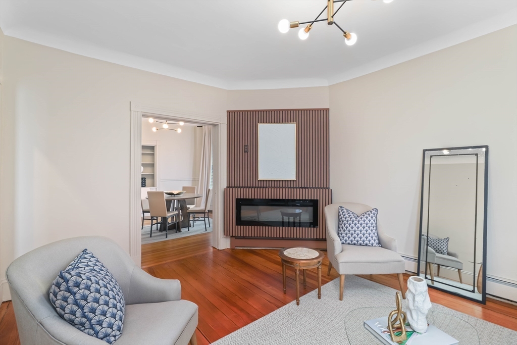 8 Spring Garden Street, Unit 3 Boston, MA 02125 - Photo 3 of 37 a living room with furniture and a fireplace