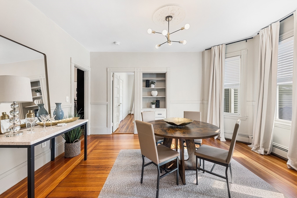 8 Spring Garden Street, Unit 3 Boston, MA 02125 - Photo 7 of 37 a dining room with furniture and window