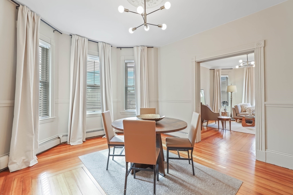 8 Spring Garden Street, Unit 3 Boston, MA 02125 - Photo 9 of 37 a view of a a dining room with furniture window and wooden floor