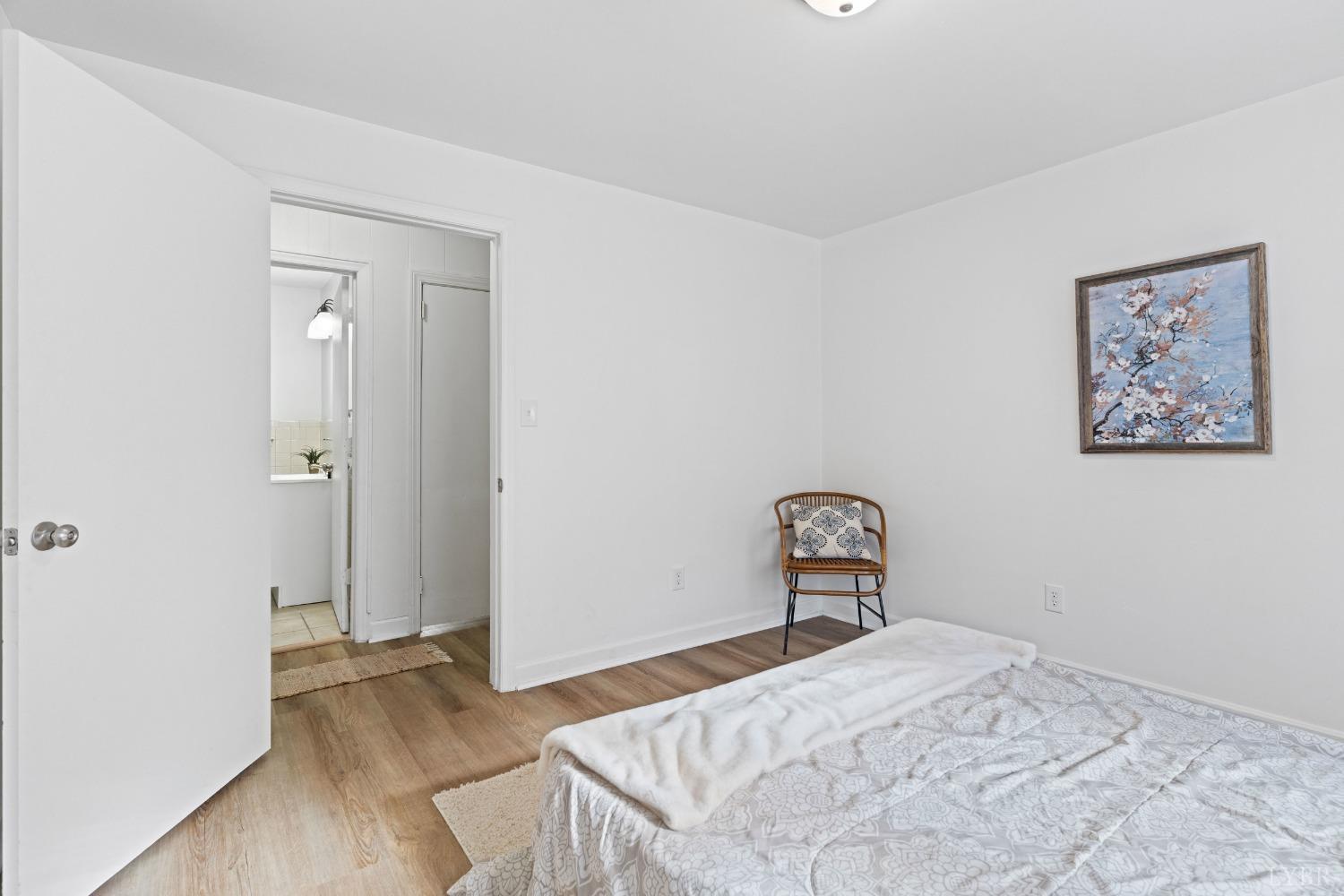 2529 Zion Road Gretna, VA 24557 - Photo 20 of 47 a bedroom with a bed and a chair