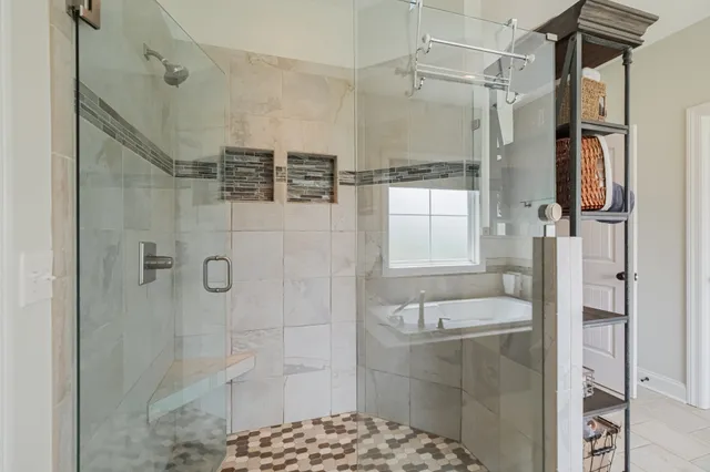 a bathroom with a shower and a sink