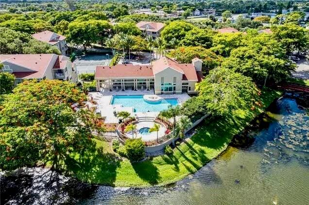 1780 Palm Cove Boulevard, Unit 6308 Delray Beach, FL 33445 - Photo 3 of 12 an aerial view of a house with a garden and lake view