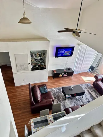 a living room with furniture and a rug