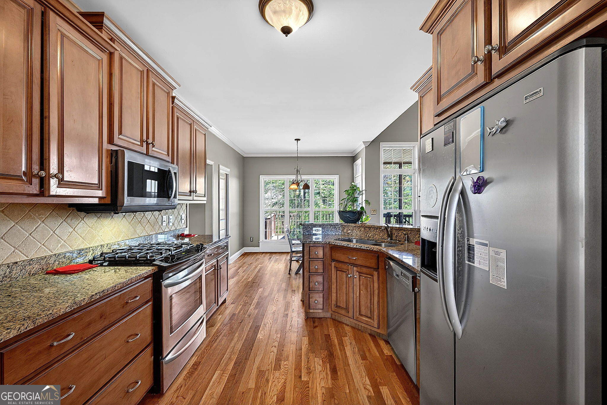 360 Happy Hill Road Carrollton, GA 30116 - Photo 15 of 50 a kitchen with stainless steel appliances granite countertop a stove and a refrigerator
