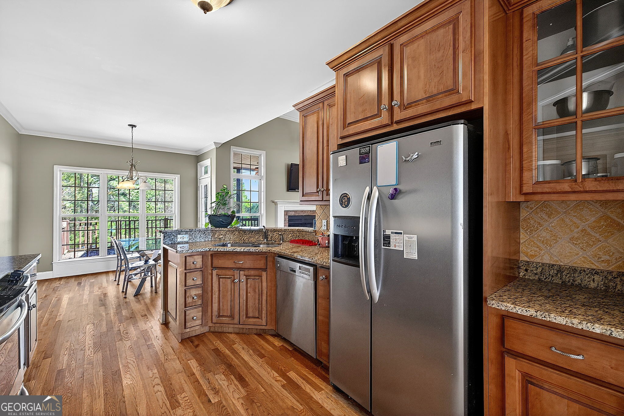 360 Happy Hill Road Carrollton, GA 30116 - Photo 16 of 50 a kitchen with stainless steel appliances granite countertop a refrigerator a stove and a wooden floors