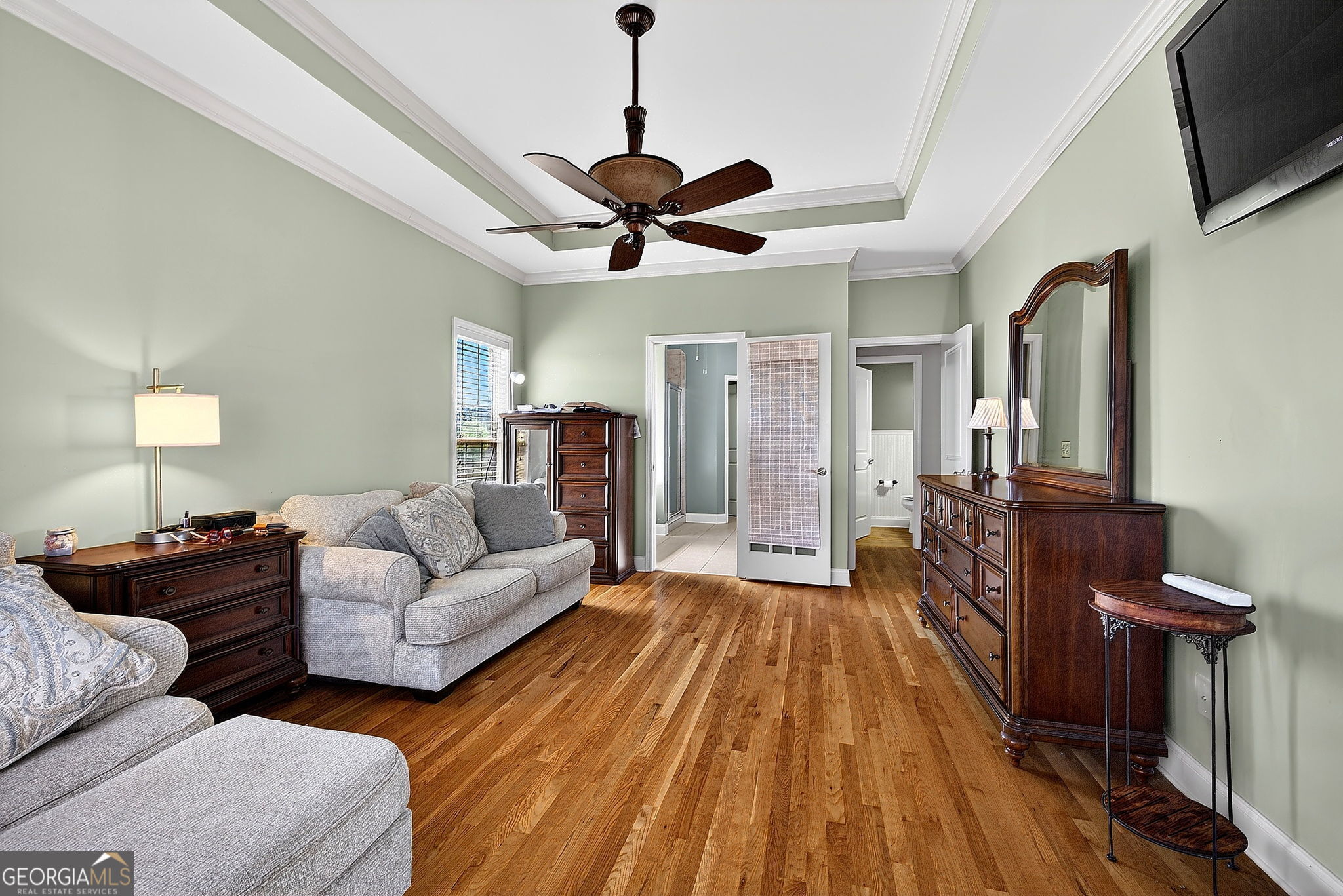 360 Happy Hill Road Carrollton, GA 30116 - Photo 21 of 50 a living room with couches a flat screen tv and kitchen view