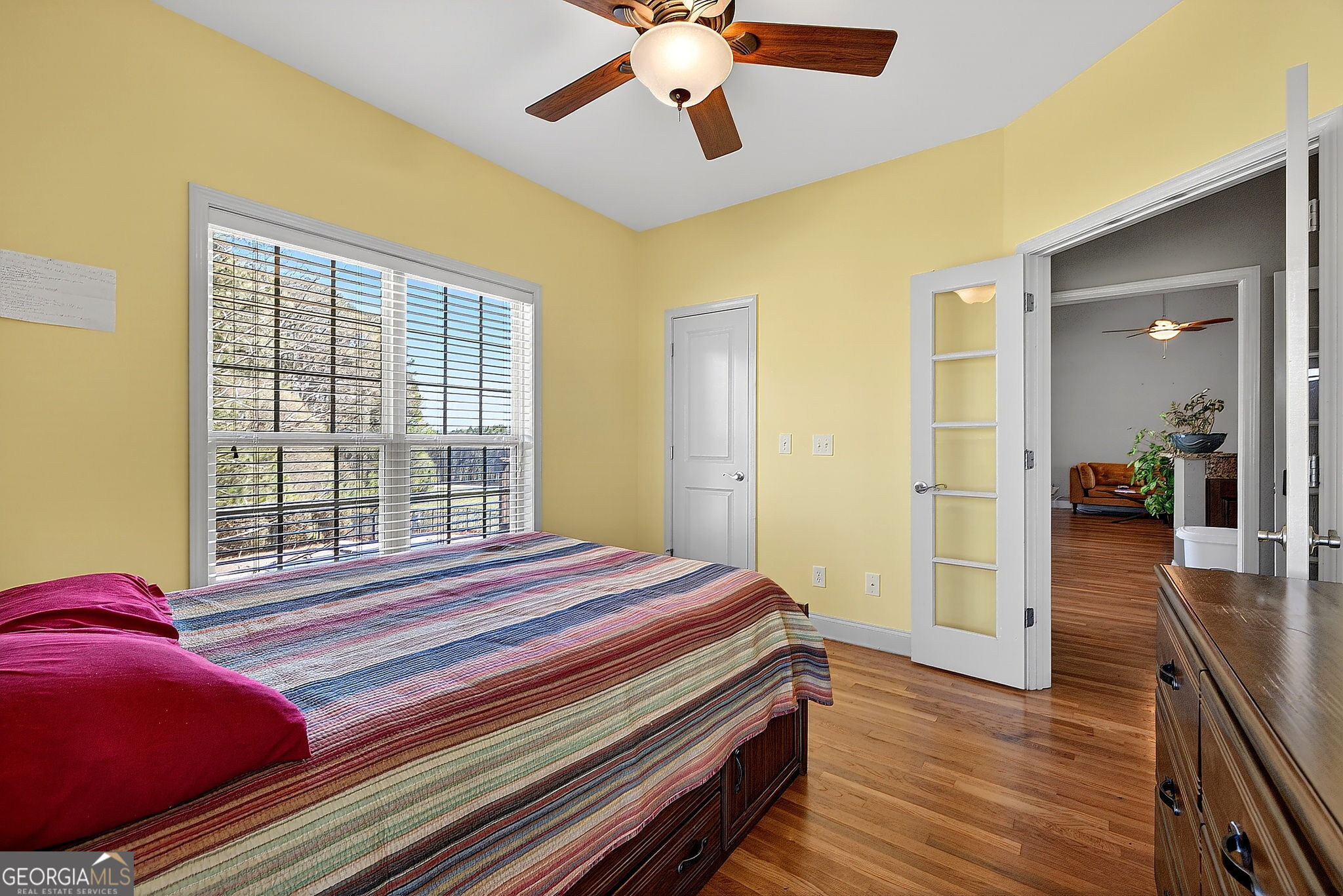 360 Happy Hill Road Carrollton, GA 30116 - Photo 24 of 50 a bedroom with a bed and wooden floor