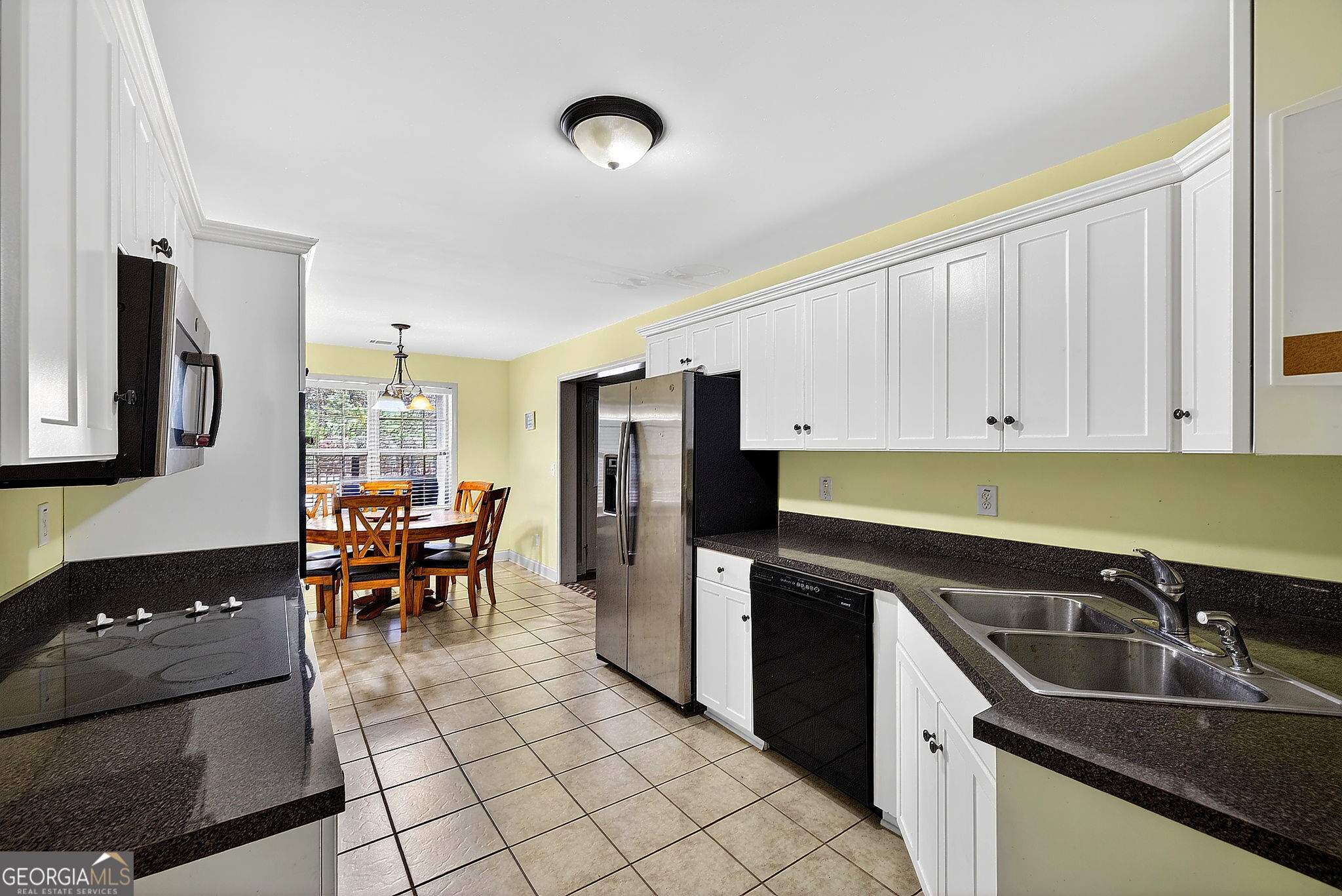 360 Happy Hill Road Carrollton, GA 30116 - Photo 28 of 50 a kitchen with a sink cabinets and stainless steel appliances