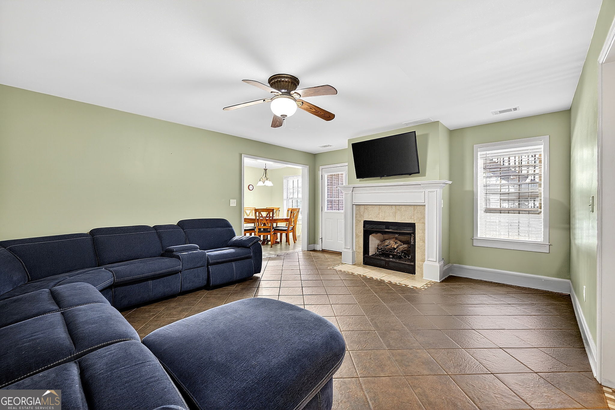360 Happy Hill Road Carrollton, GA 30116 - Photo 31 of 50 a living room with furniture a flat screen tv and a fireplace