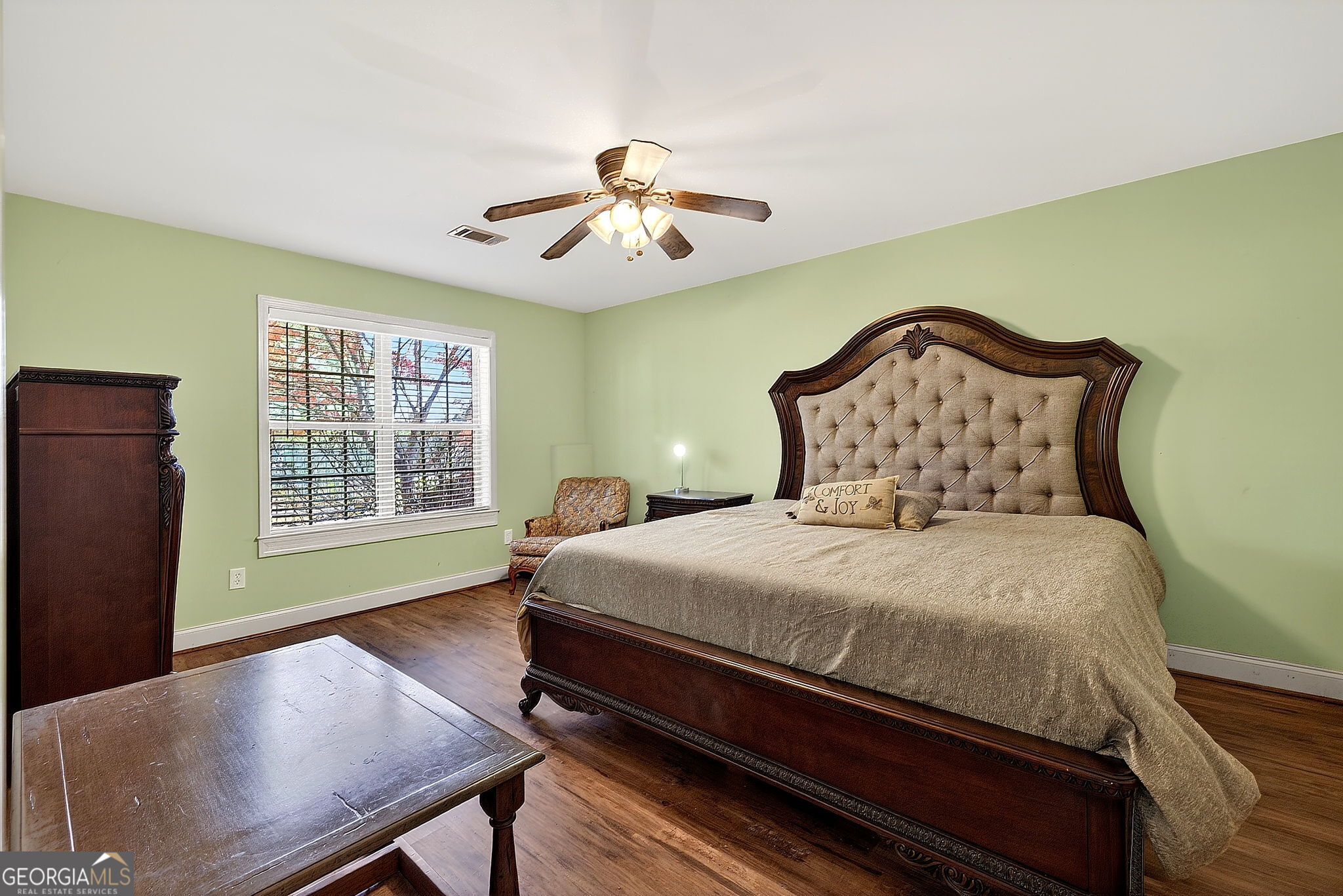 360 Happy Hill Road Carrollton, GA 30116 - Photo 33 of 50 a bedroom with a bed and a chandelier