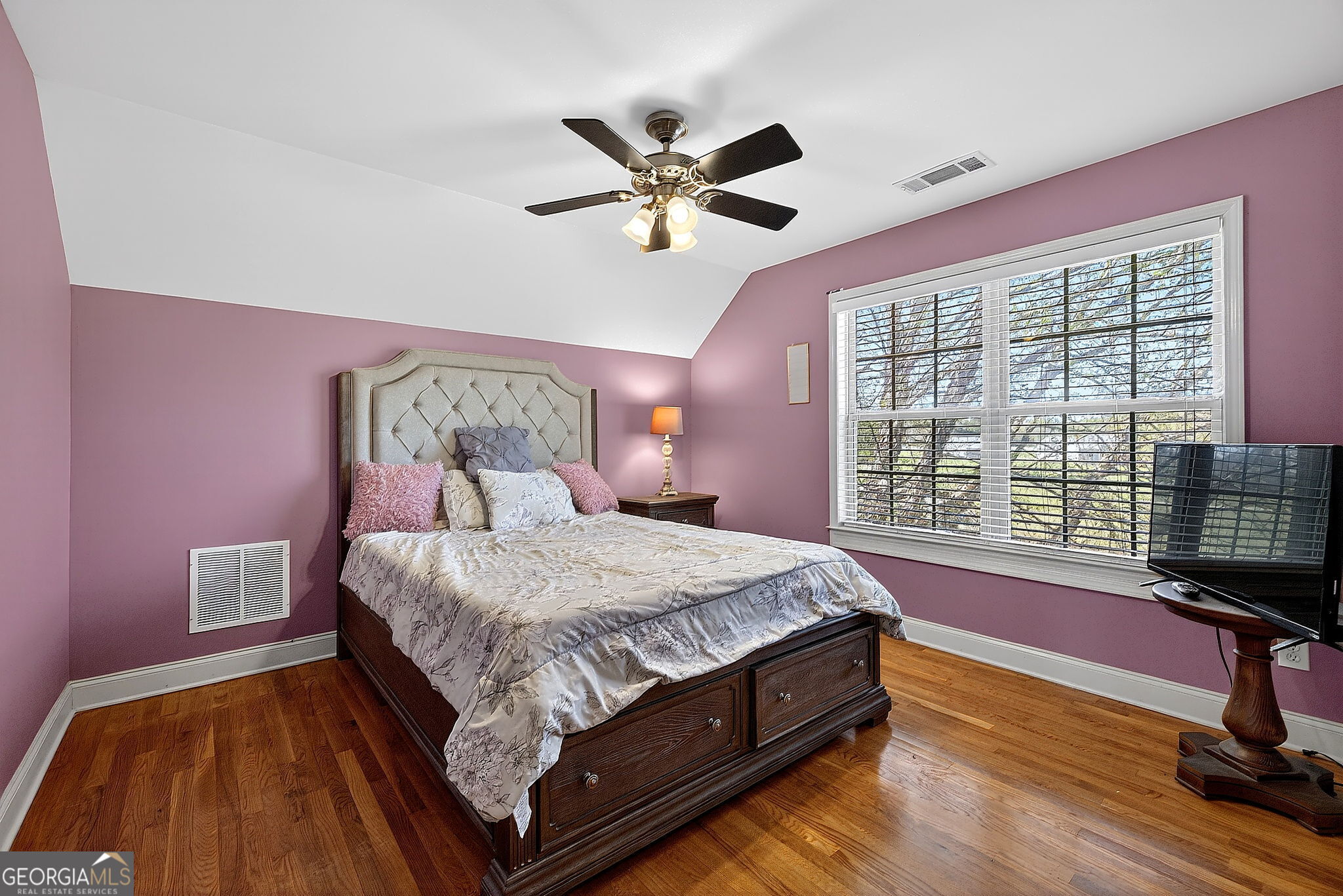 360 Happy Hill Road Carrollton, GA 30116 - Photo 38 of 50 a bed sitting in a bedroom next to a window