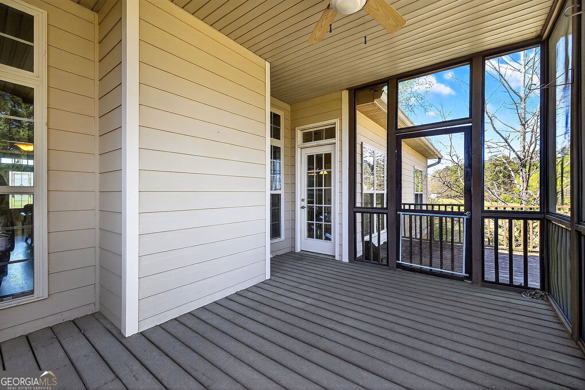 360 Happy Hill Road Carrollton, GA 30116 - Photo 41 of 50 a view of a porch with wooden floor and floor to ceiling window