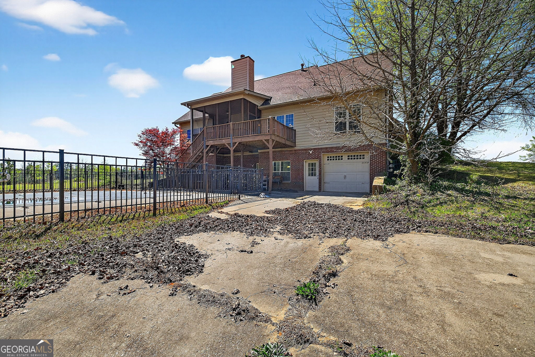 360 Happy Hill Road Carrollton, GA 30116 - Photo 46 of 50 a view of a brick house next to a yard with large trees