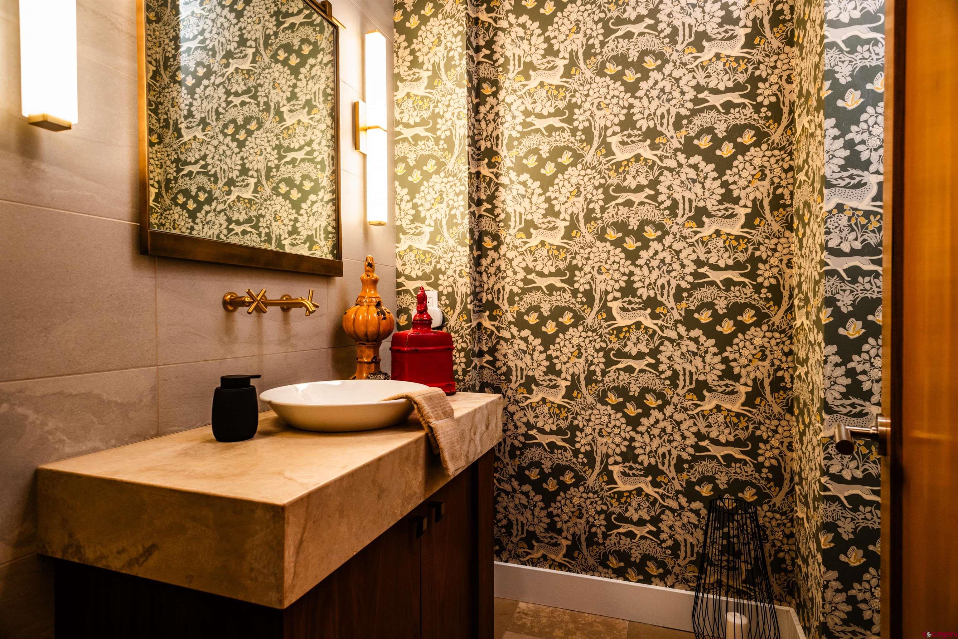 235 Rock Point Drive, Unit 235B Durango, CO 81301 - Photo 17 of 37 a kitchen with a sink and a refrigerator