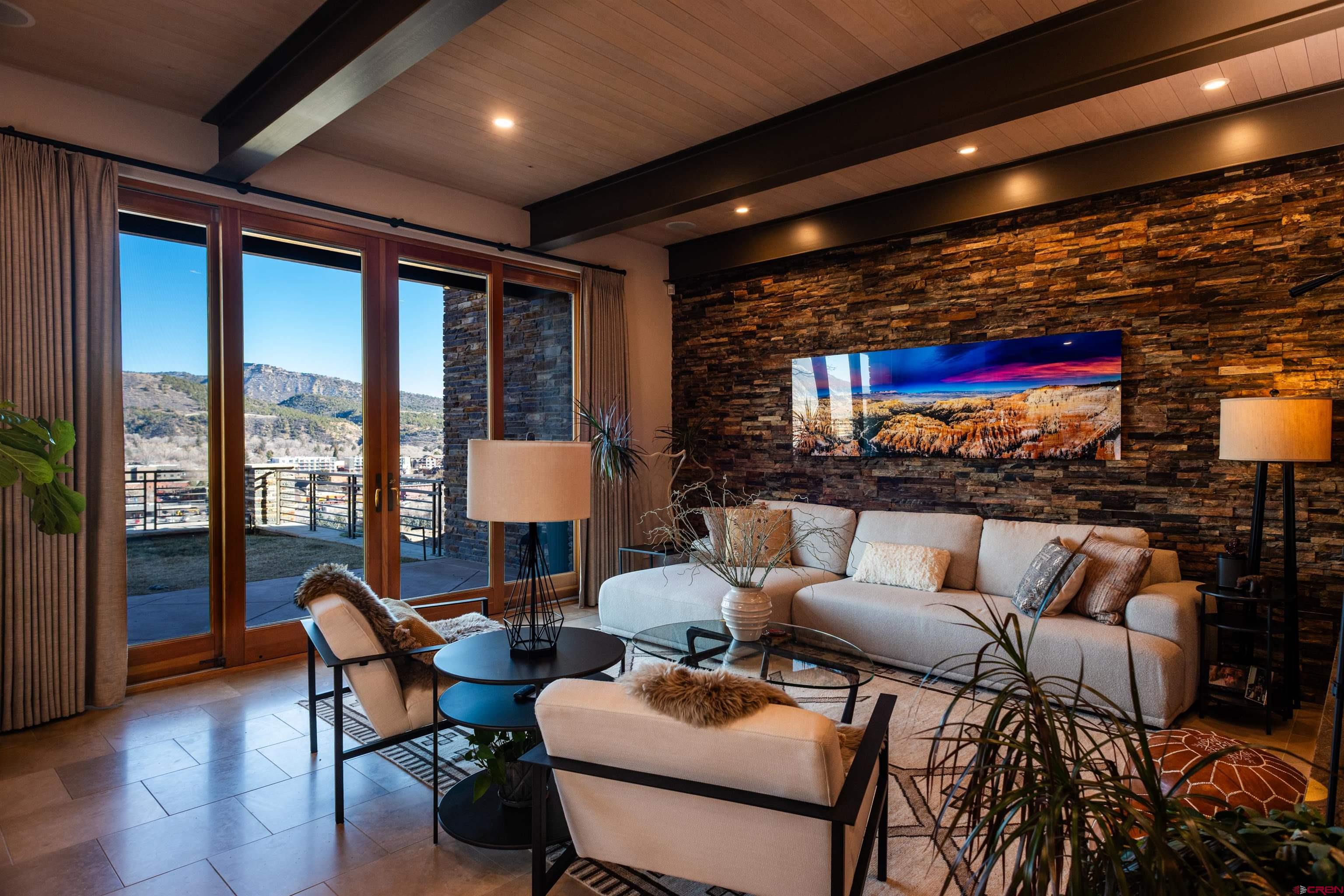 235 Rock Point Drive, Unit 235B Durango, CO 81301 - Photo 2 of 37 a outdoor space with patio couch and a potted plant