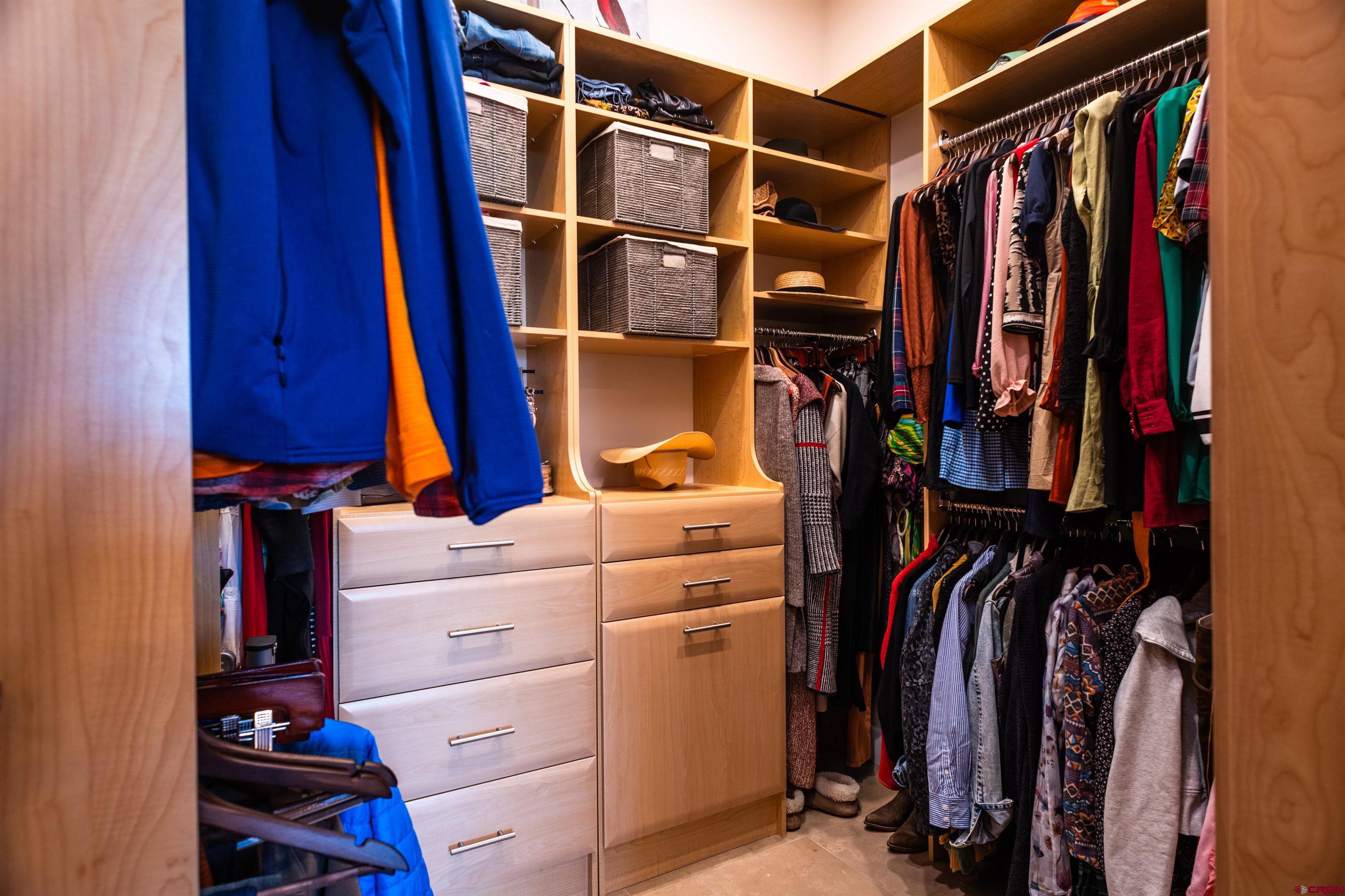 235 Rock Point Drive, Unit 235B Durango, CO 81301 - Photo 25 of 37 a view of walk in closet with clothes and shoes