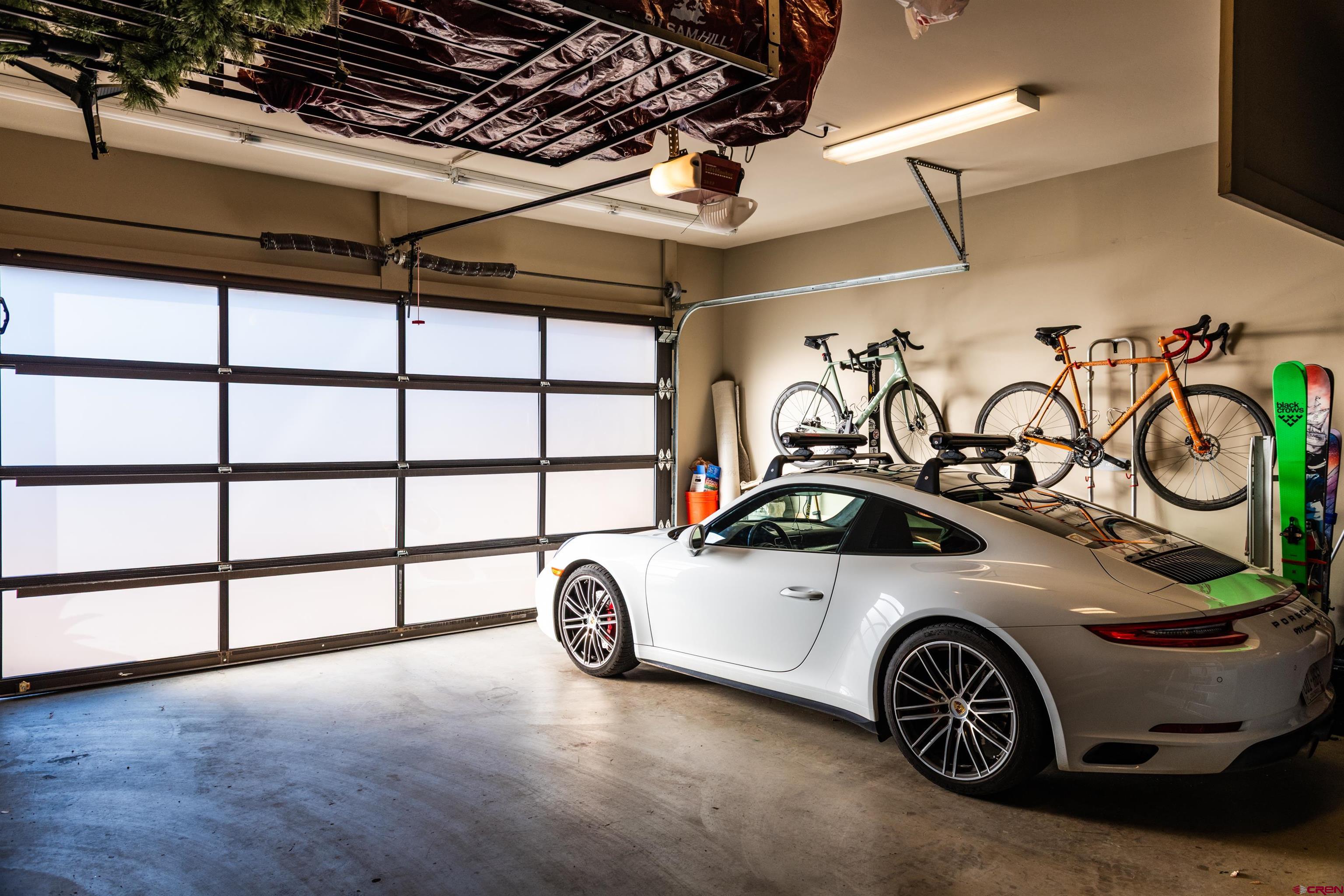 235 Rock Point Drive, Unit 235B Durango, CO 81301 - Photo 35 of 37 a car parked in a garage