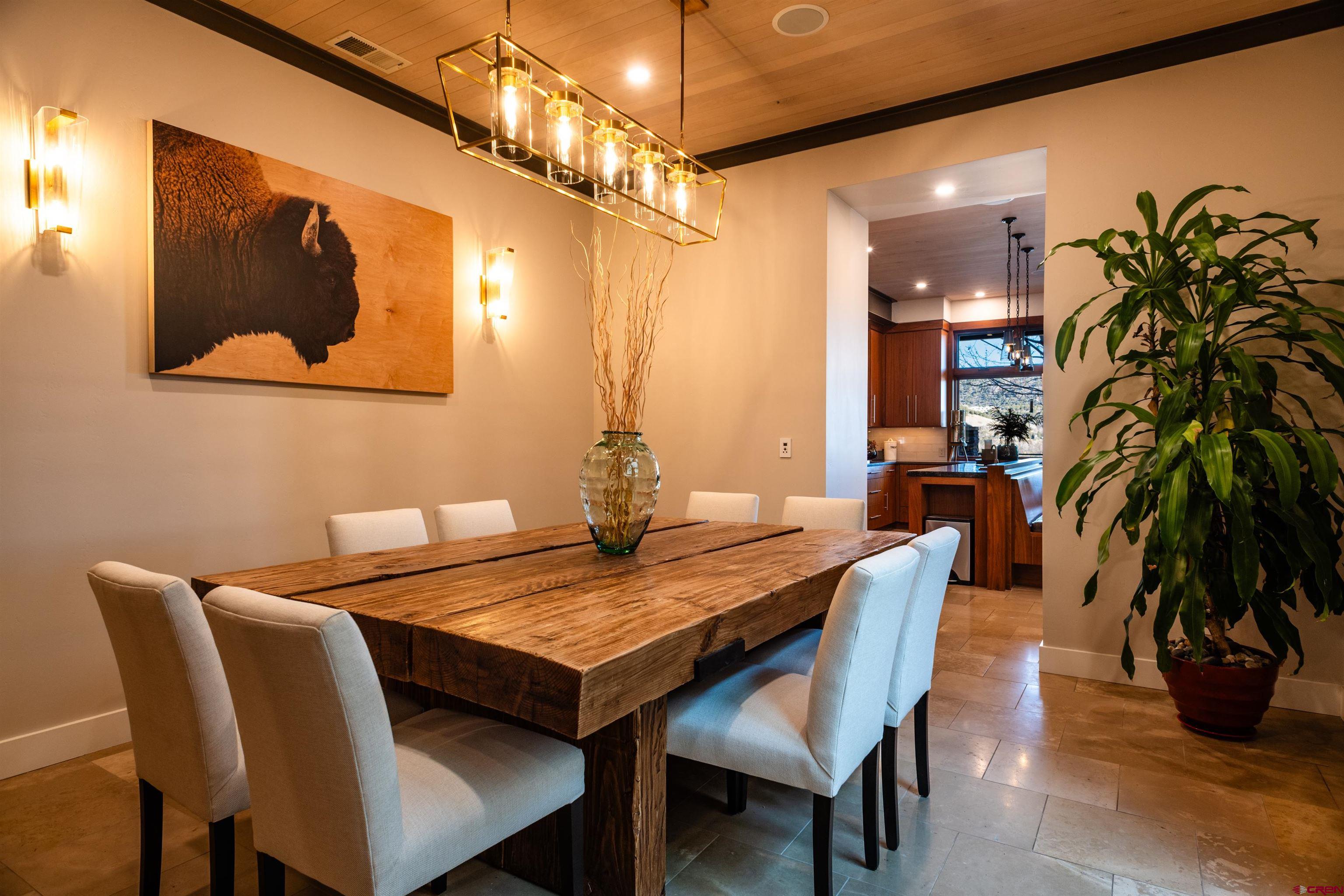 235 Rock Point Drive, Unit 235B Durango, CO 81301 - Photo 10 of 37 a dining room with furniture and wooden floor