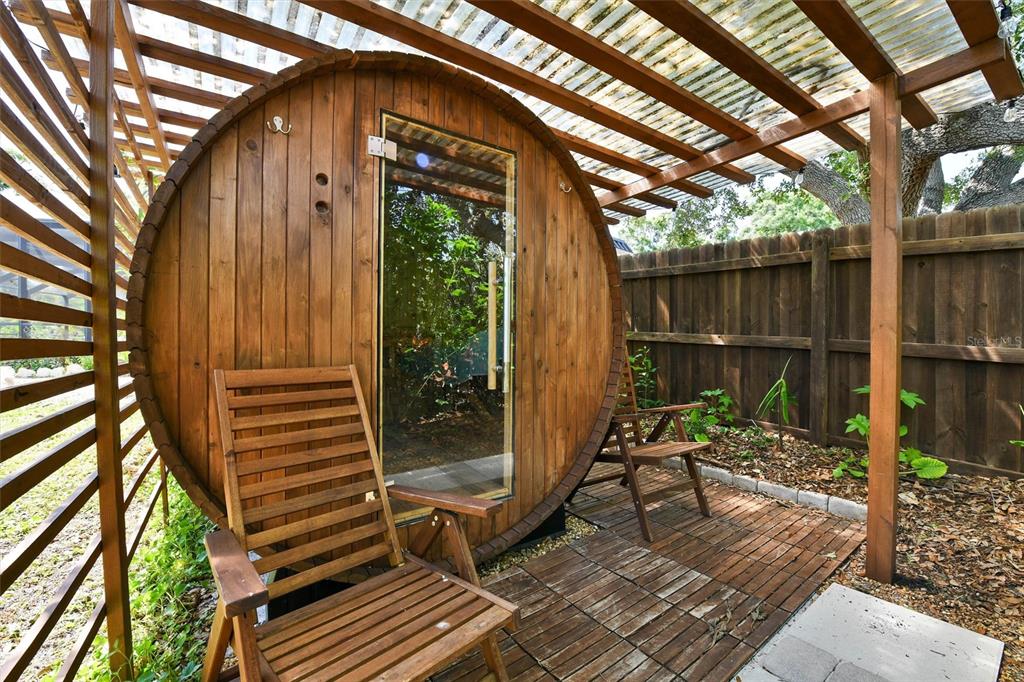 1875 Belleair Road Clearwater, FL 33764 - Photo 75 of 100 a view of backyard with wooden fence and large trees