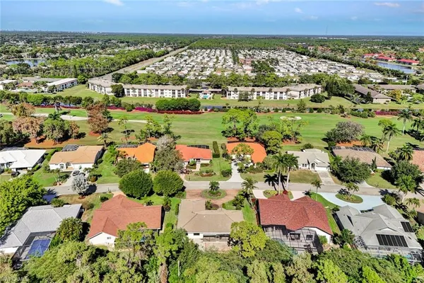 an aerial view of residential houses and outdoor space