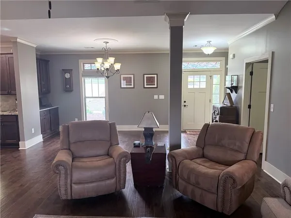 a large kitchen with a table and chairs