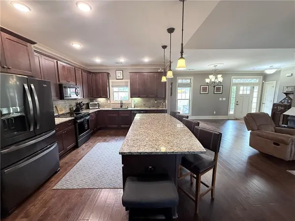 a kitchen with granite countertop cabinets and sink