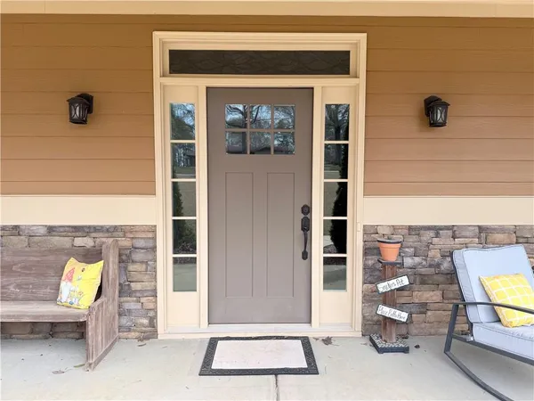 a front view of a house with outdoor seating space