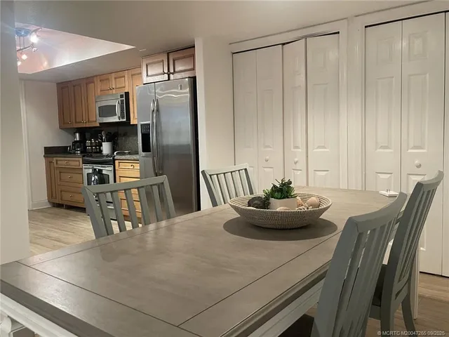 a kitchen with a table and chairs