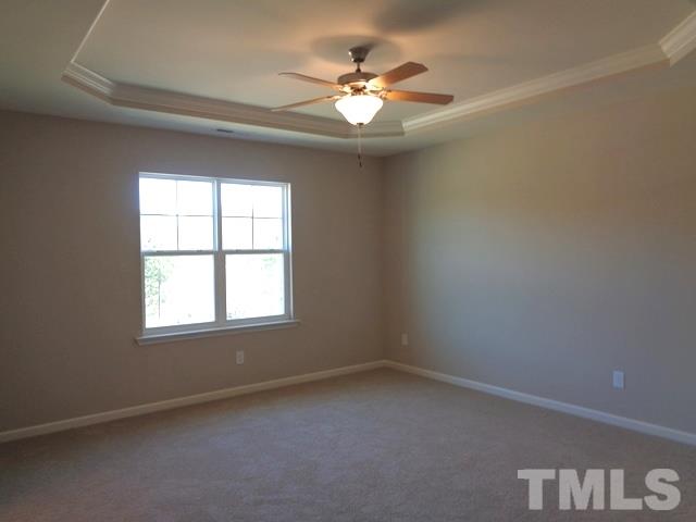 111 Torpoint Road Durham, NC 27703 - Photo 11 of 25 an empty room with windows and ceiling fan