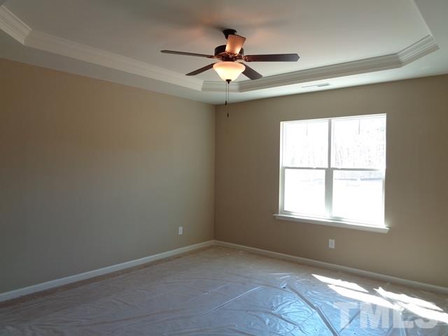 111 Torpoint Road Durham, NC 27703 - Photo 16 of 25 an empty room with a window and a fan