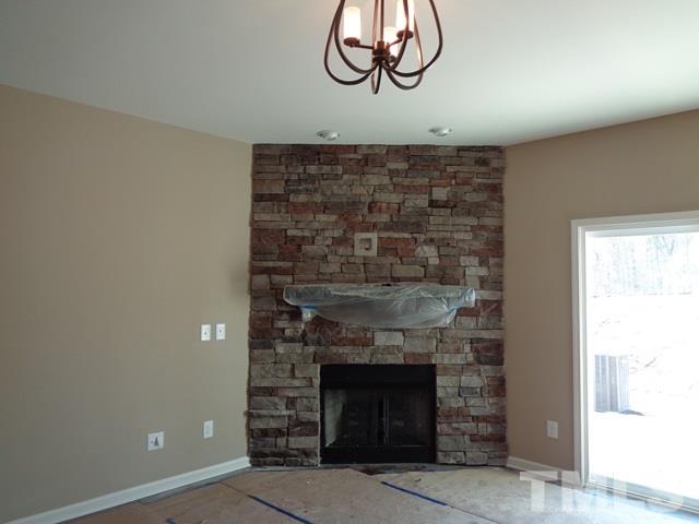 111 Torpoint Road Durham, NC 27703 - Photo 5 of 25 a room with fireplace