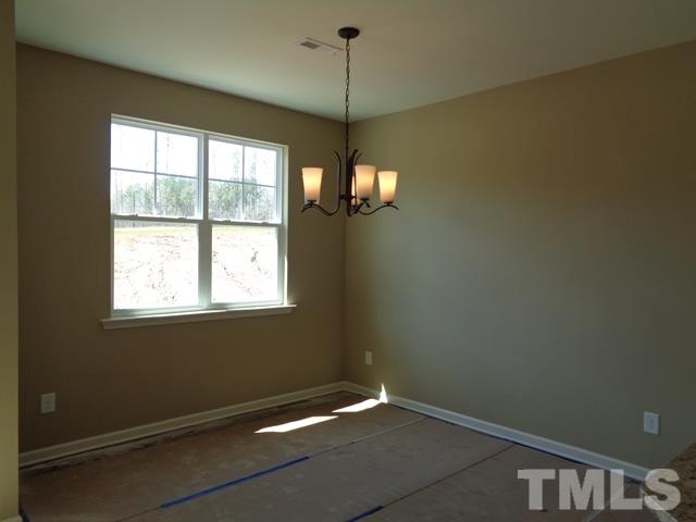 111 Torpoint Road Durham, NC 27703 - Photo 6 of 25 a room with a window and ceiling fan