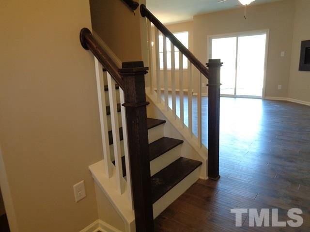 111 Torpoint Road Durham, NC 27703 - Photo 7 of 25 a view of entryway with wooden floor and stairs