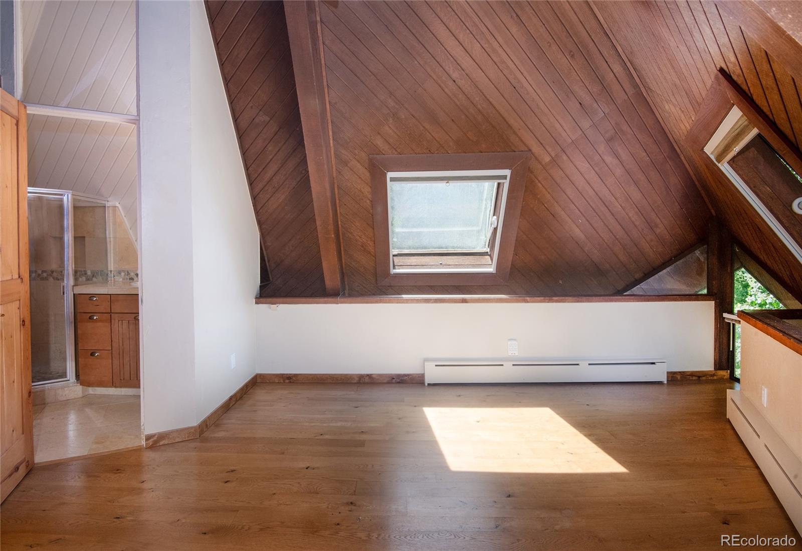 1400 Lions Ridge Loop, Unit A5 Vail, CO 81657 - Photo 14 of 28 a view of a hallway with wooden floor
