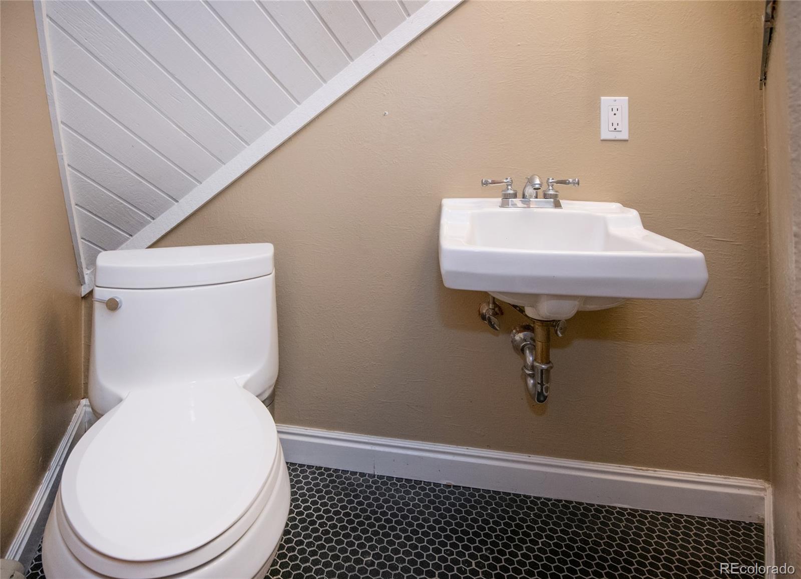 1400 Lions Ridge Loop, Unit A5 Vail, CO 81657 - Photo 23 of 28 a bathroom with a sink toilet and a mirror