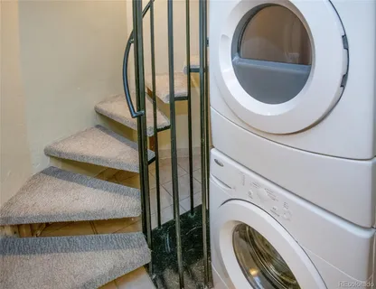 a close view of a utility room with washer and dryer