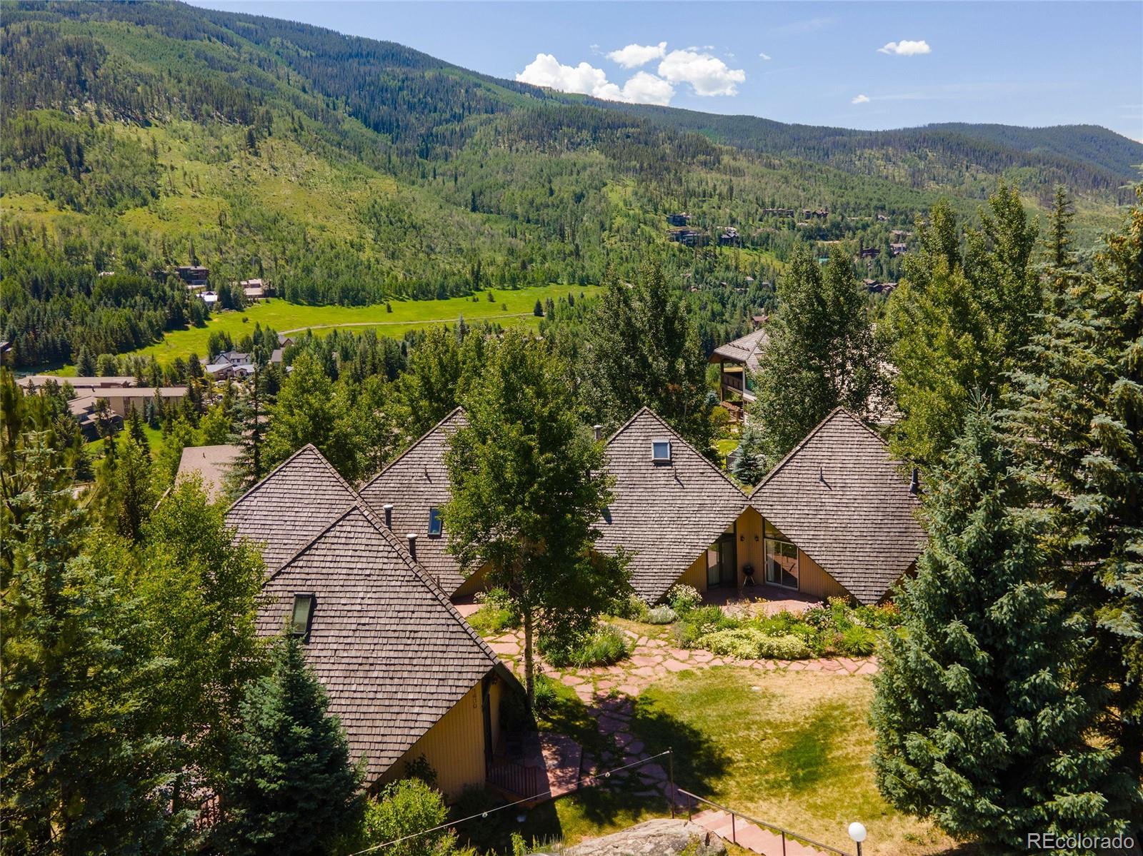 1400 Lions Ridge Loop, Unit A5 Vail, CO 81657 - Photo 27 of 28 an aerial view of houses with yard